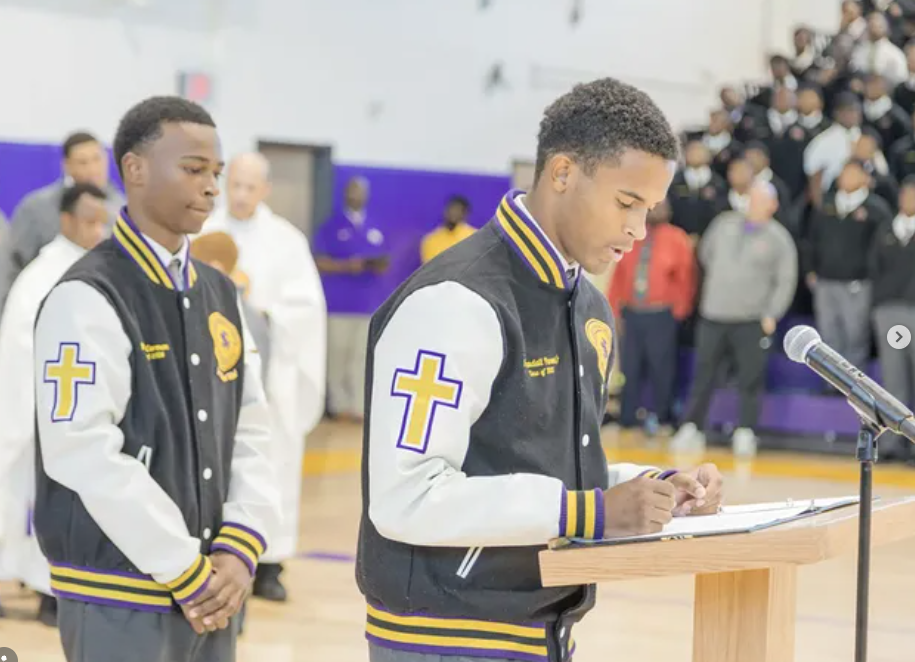 Purple Knight lettermen participating in a school ceremony