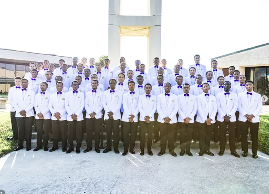 Purple Knights wearing traditional white jackets